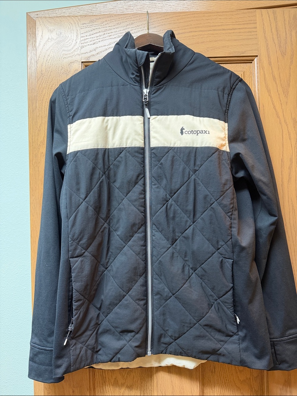 cotopaxi Black Quilted Jacket with Cream Chest Stripe